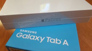 iPad mini 4 box on top of a Samsung Galaxy Tab A box. 